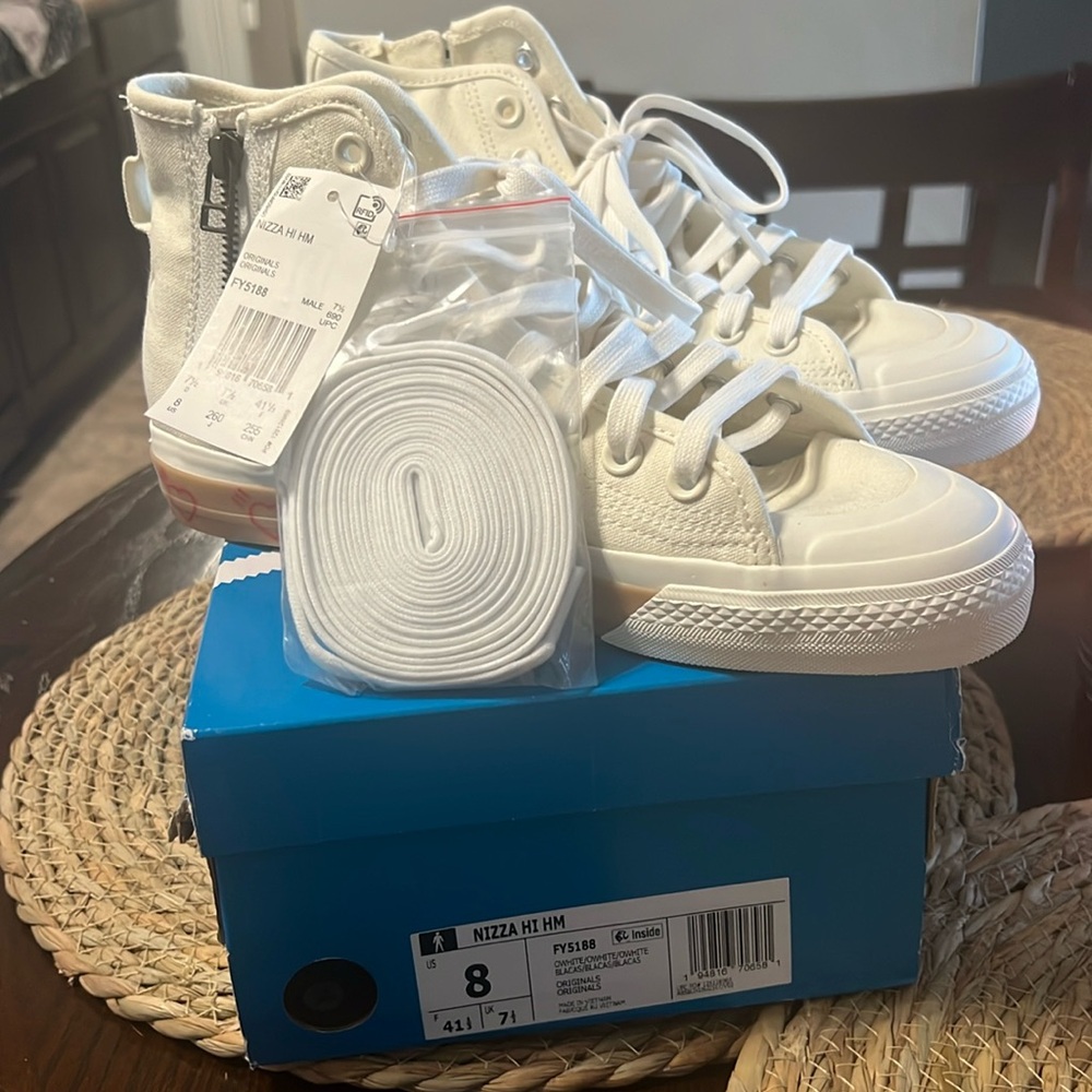 Men’s size 8 Addias sneakers - New with tags and box- Never worn.